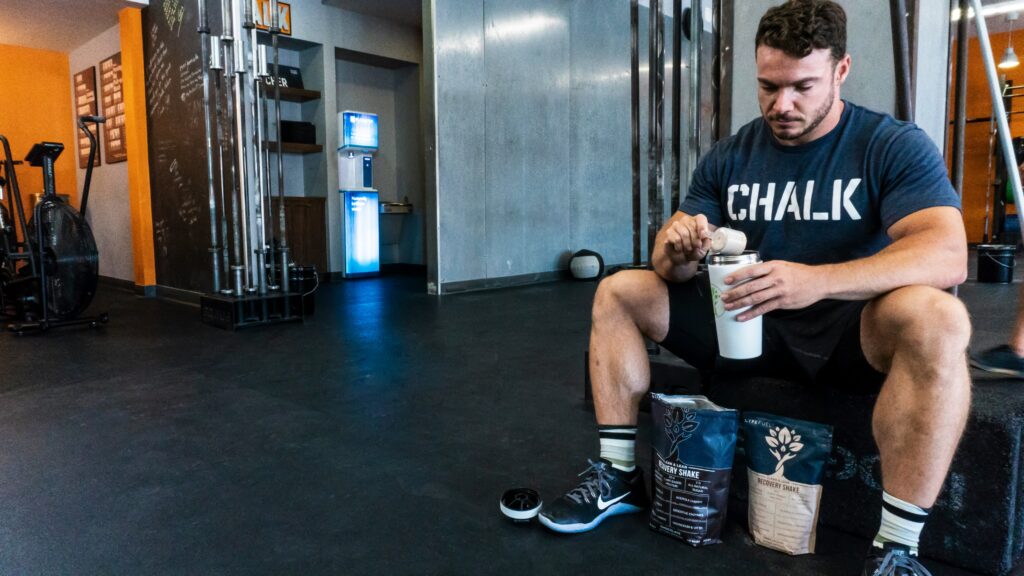 a man consuming his shake post workout