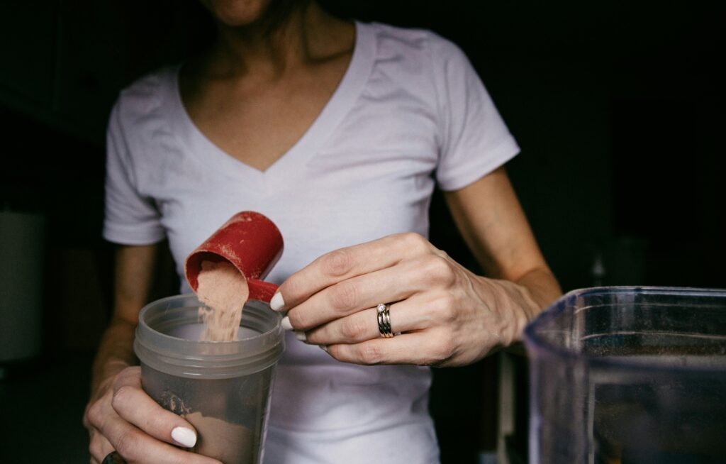 a women drinking whey protein