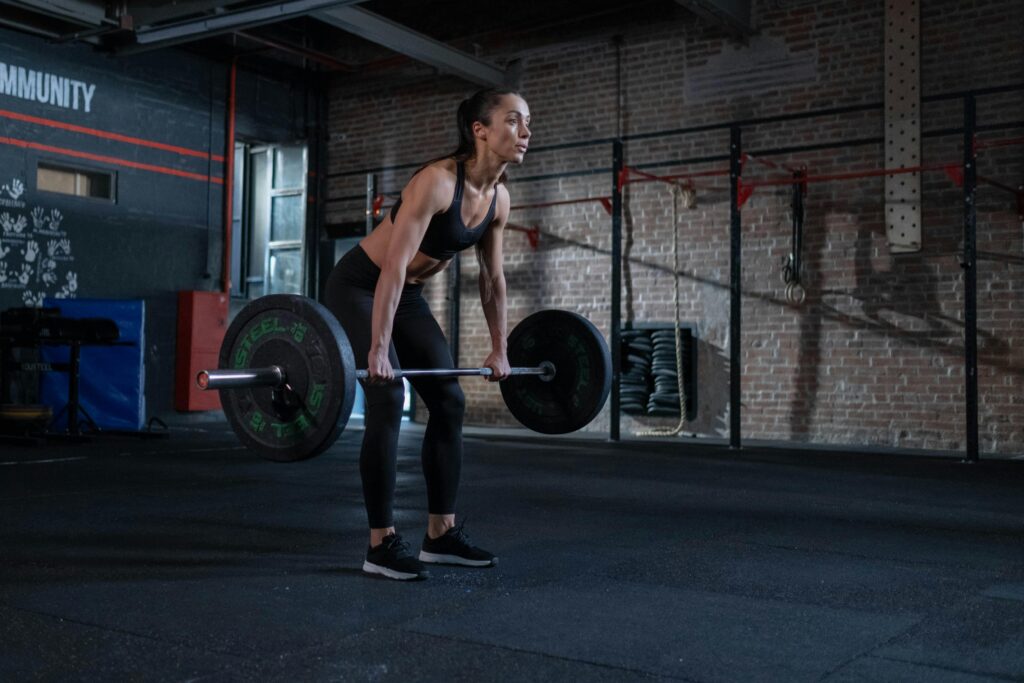 a woman performing deadlifts